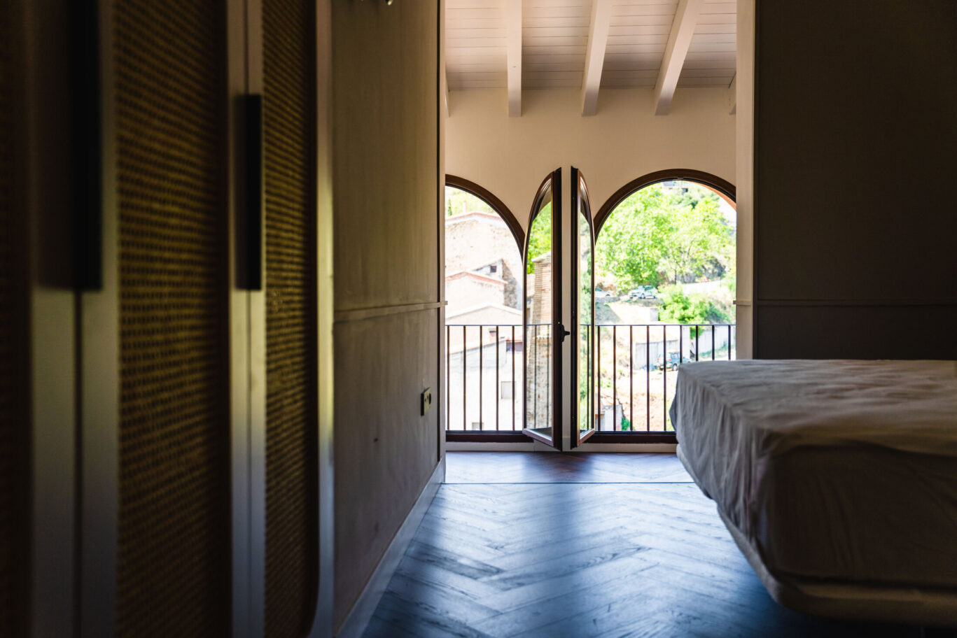 View from inside of the bedroom looking towards two windows